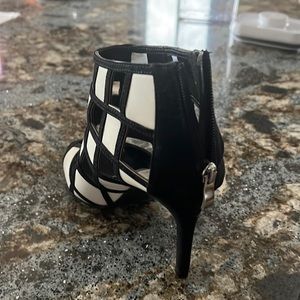 N.Y.L.Y. Size 8, Black & White lattice look 4” dress shoe. Zips up the back.
